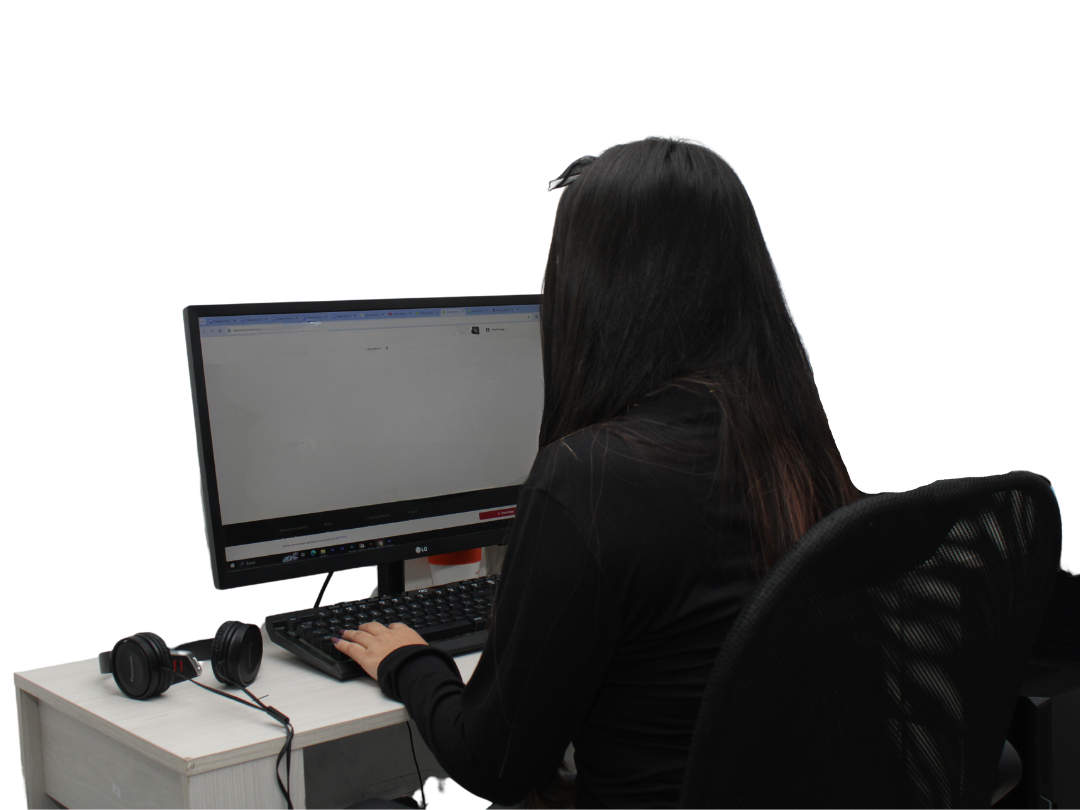 A woman typing in front of a computer